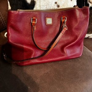 Beautiful red/burgundy Dooney  and Burke double zip satchel .